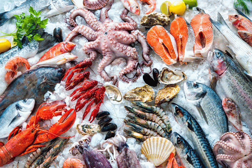 A variety of fish and seafood on ice.