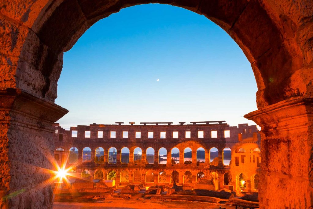 Sunlight illuminating the Ancient Roman amphitheatre in Pula, Croatia.