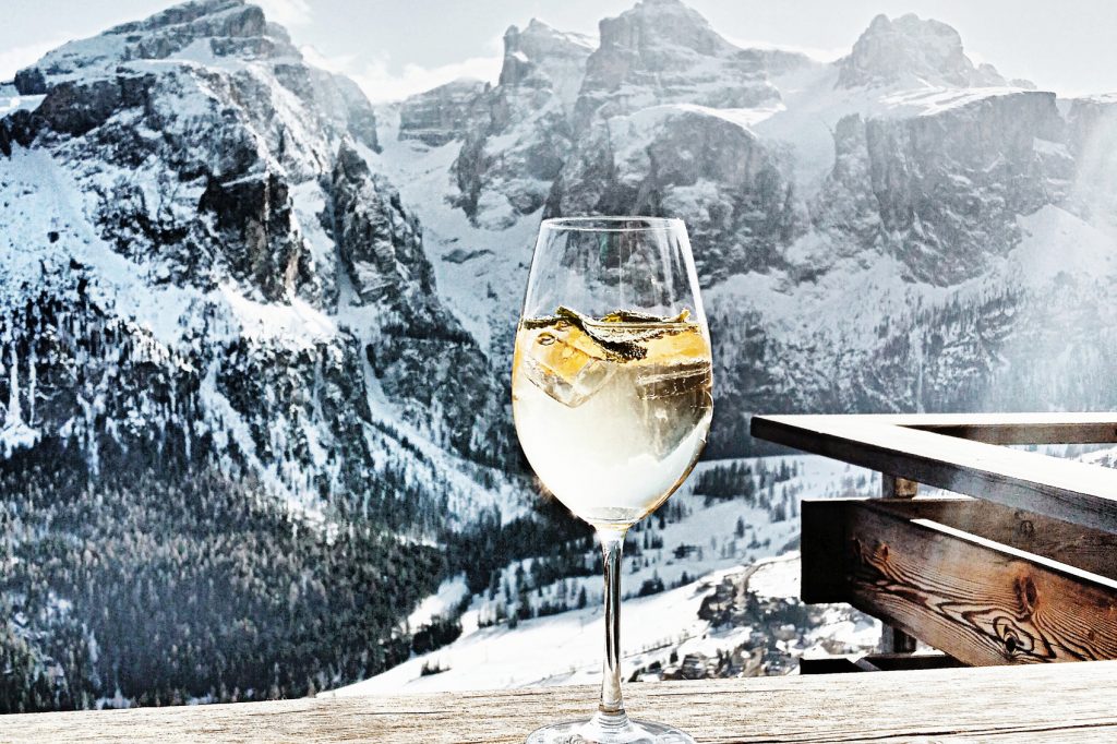 Snowy mountains and a glass of wine