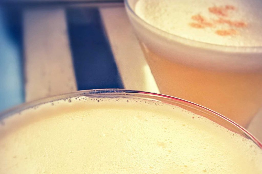 A refreshing Pisco Sour in a glass.