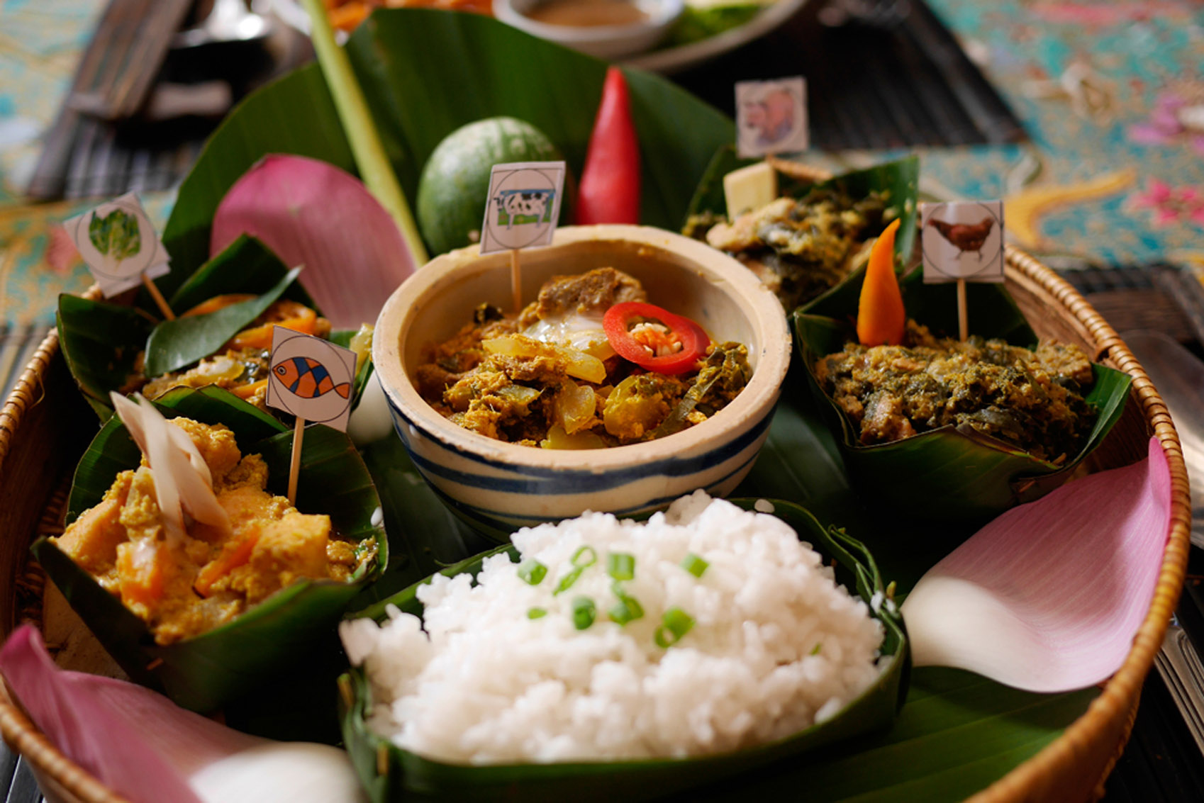 A plate of Southeast Asian food on a table.