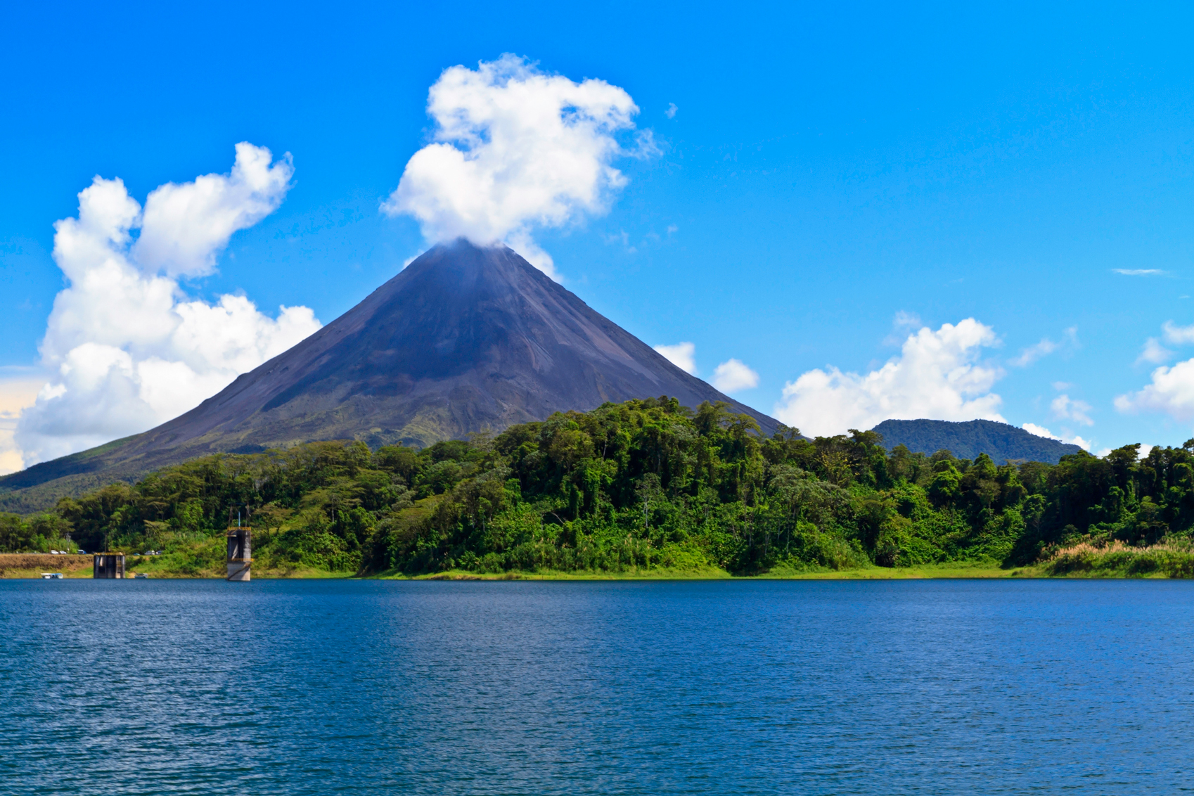 A lake with a mesmerizing view of a volcano in the background, perfect for starting the new year with awe-inspiring beauty.