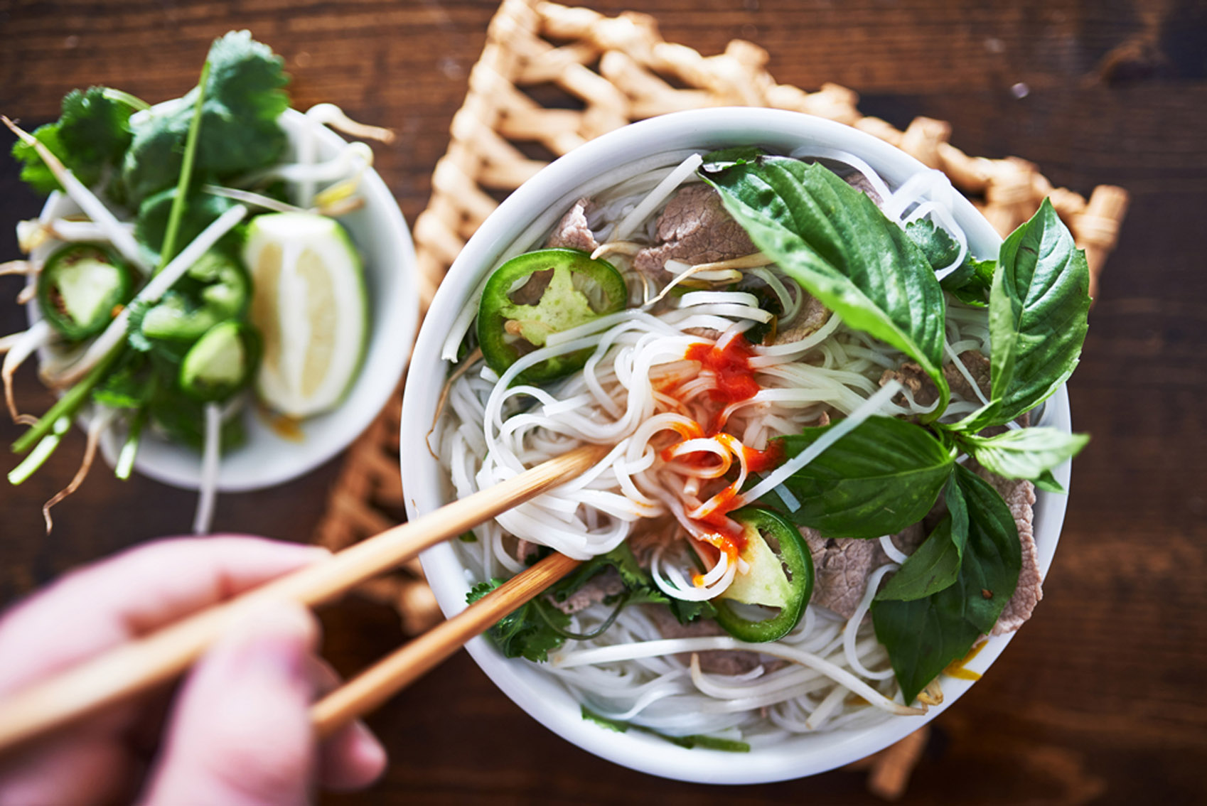 Southeast Asian Dishes: Vietnamese noodle soup with chopsticks.