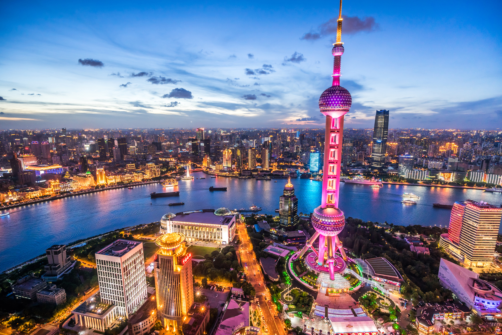Reasons to visit China Shanghai-Skyline,-Dusk-www.istockphoto.com_gb_photo_shanghai-skyline-at-dusk-gm587787576-100894697-Yongyuan-Dai