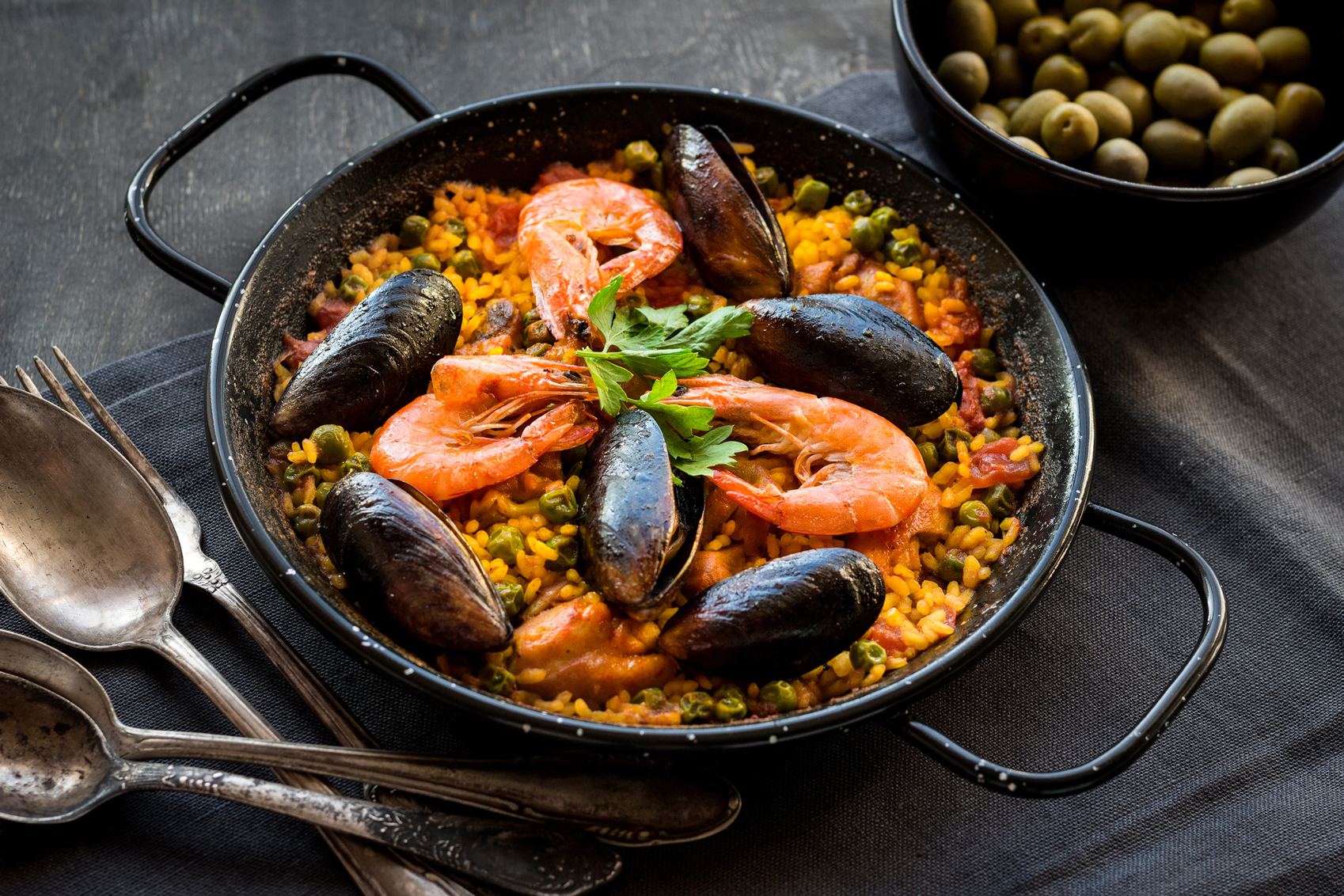 Spain Photos Paella-on-a-table-www.istockphoto.com_gb_photo_paella-on-a-table-gm614873048-106539183-thesomegirl-