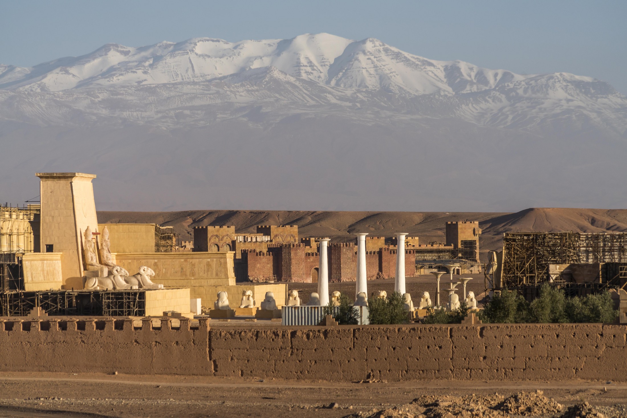 A picturesque city surrounded by majestic mountains, perfect for filming locations.