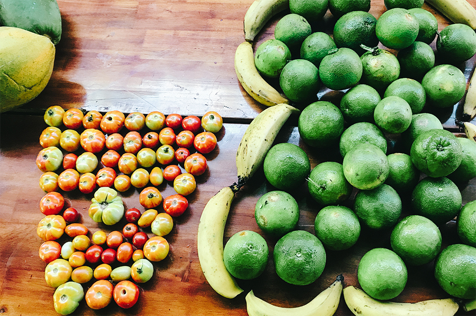 A bunch of fruit on a table.