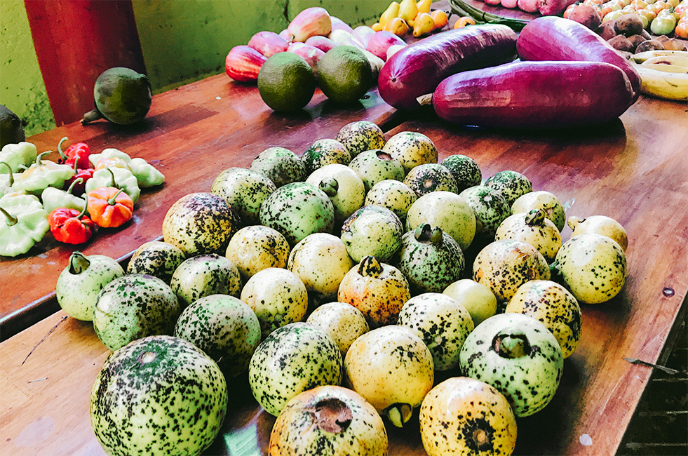 A table with different fruits and vegetables.