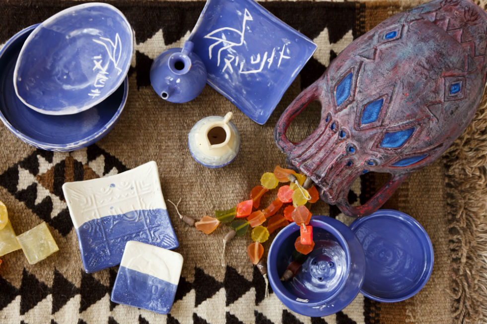 Pottery from Iraq Al-Amir Women's Cooperative on a rug.