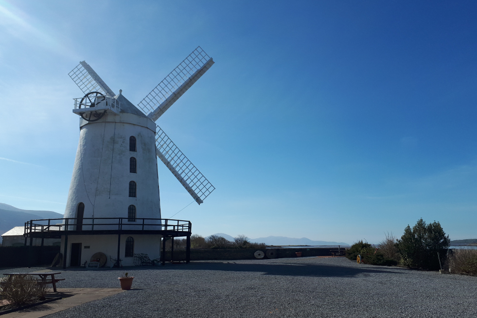 A unique white windmill on a gravel road in Ireland provides unforgettable family experiences.