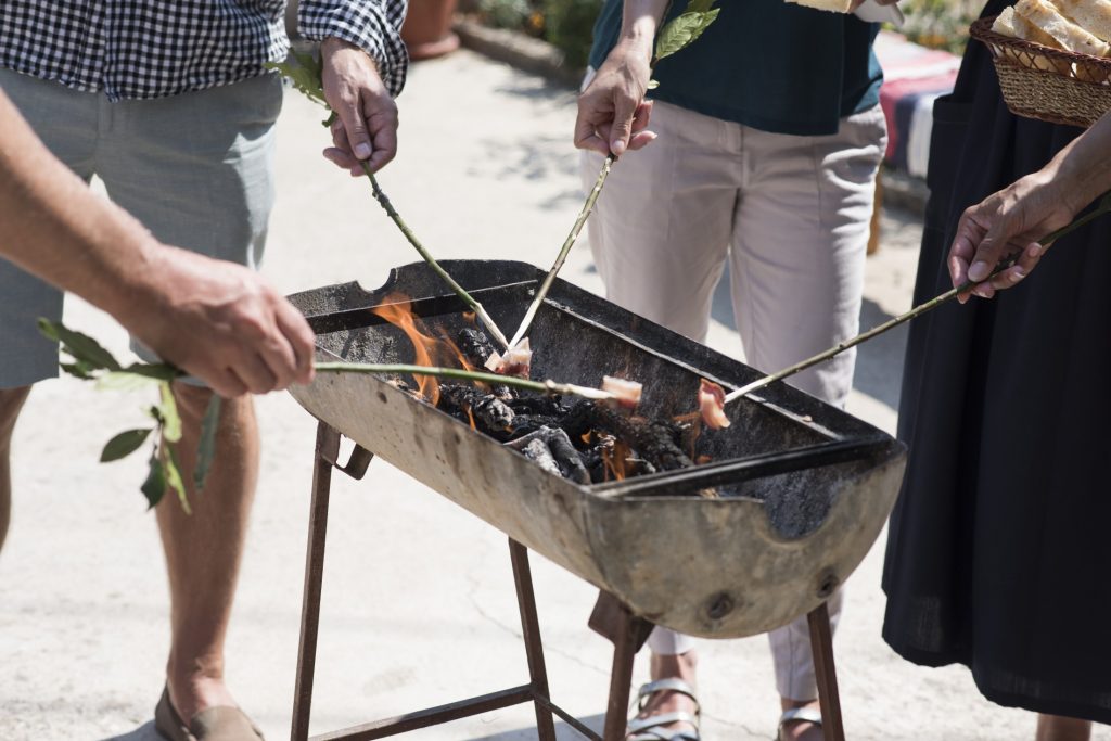 A group of Osojnik preparing a bbq for a party.