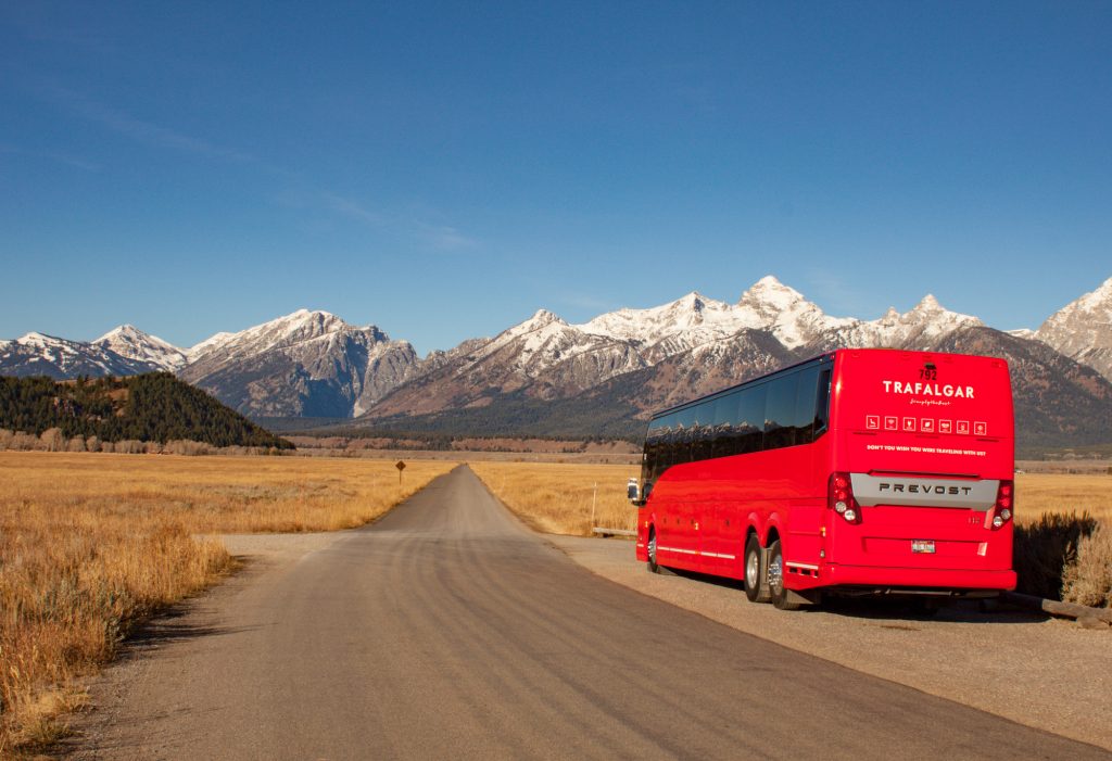 A red bus parked on a road.