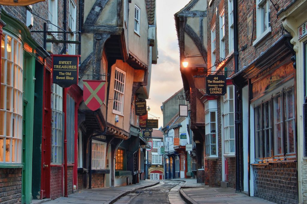 A narrow street in a city.