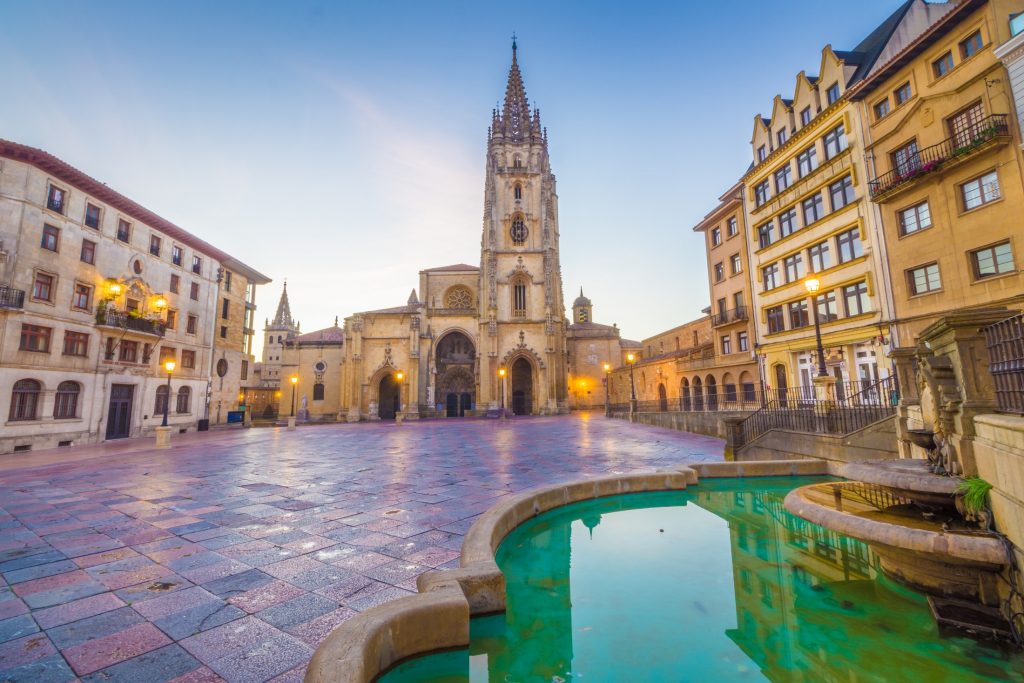 A fountain in the middle of a square.