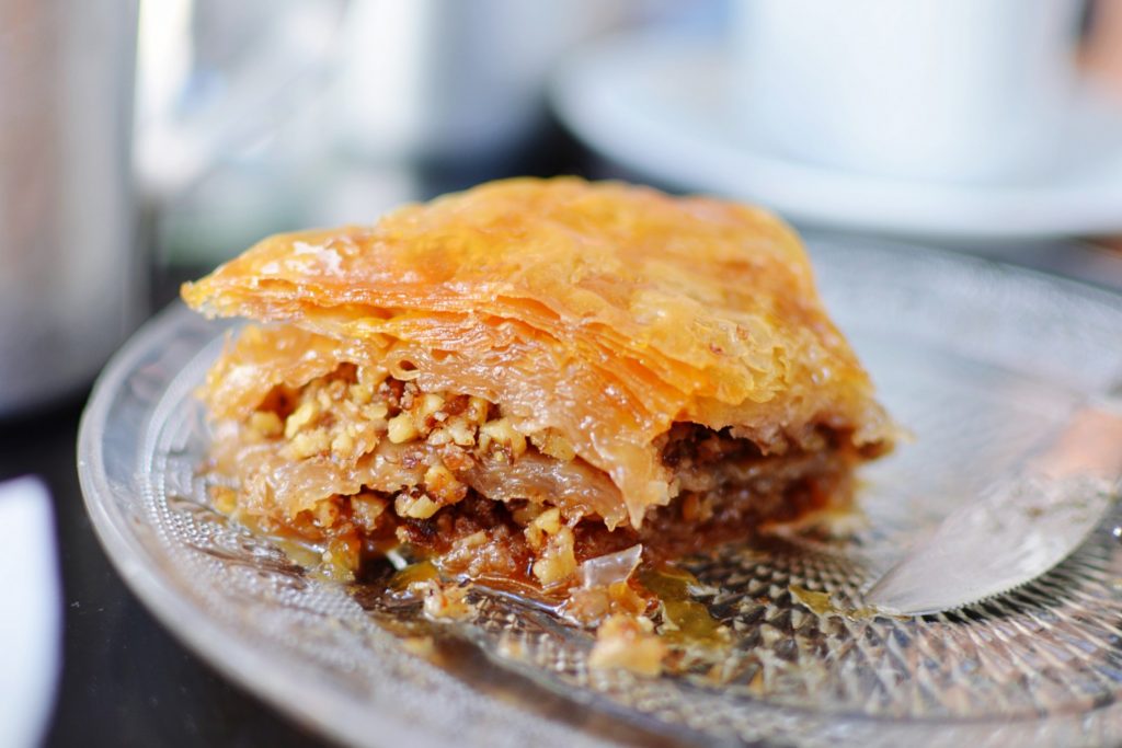 A piece of cake with Greek flavours on a plate.