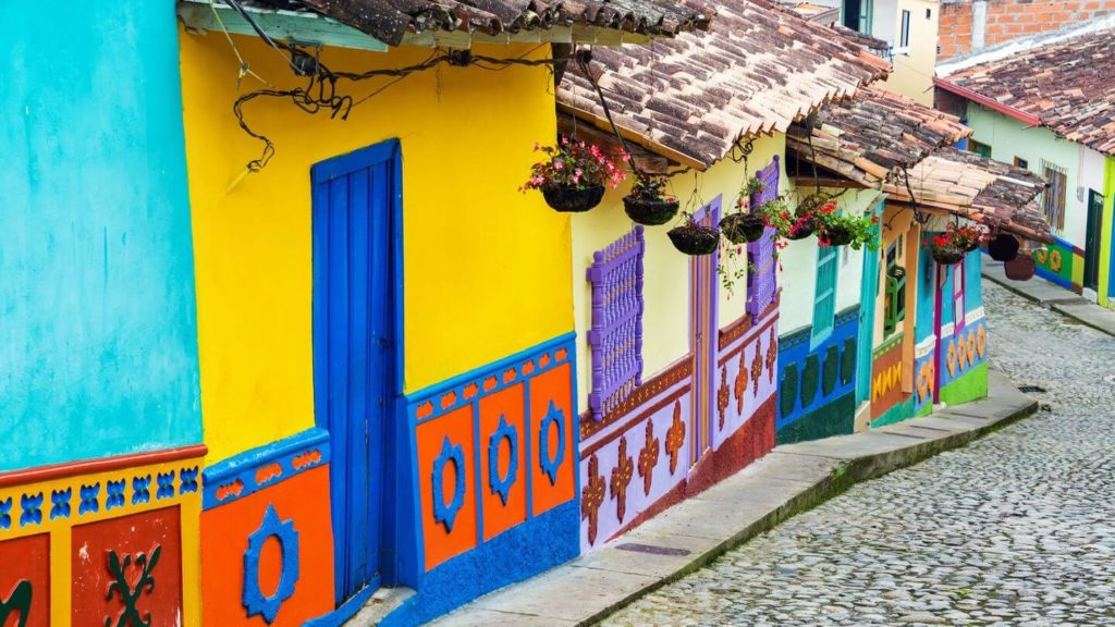 Colorful painted houses on a cobblestone street, inspired by the Chinese zodiac sign.