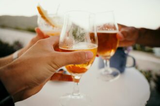 beer glasses clinking together