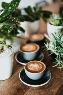 coffee mugs lines up alongside one another