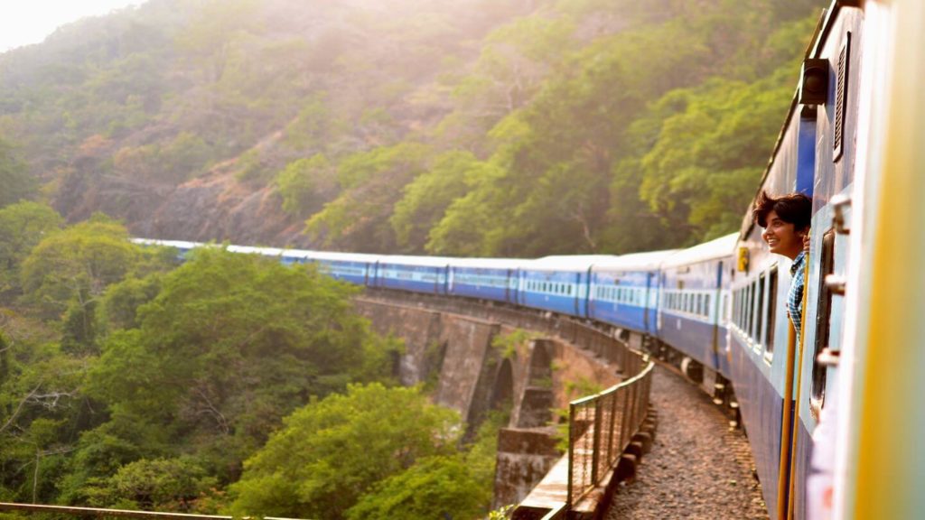 woman leaning out of train