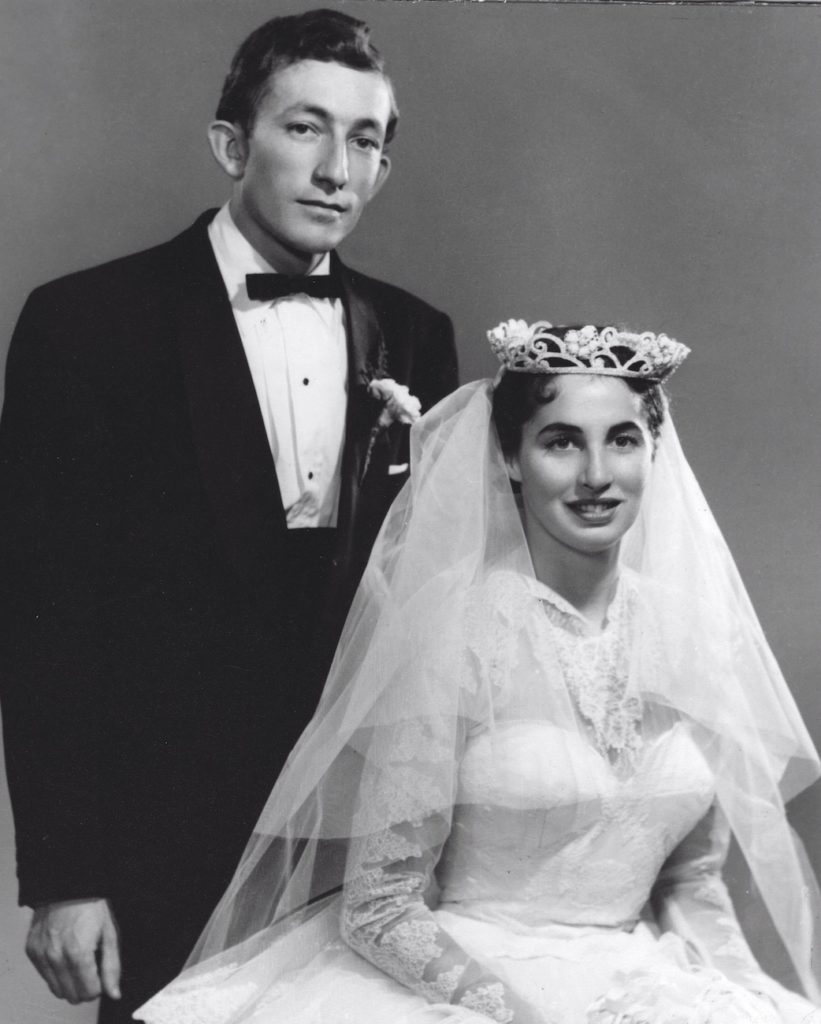 A romantic black and white photo of a man and woman posing for Valentine's Day.