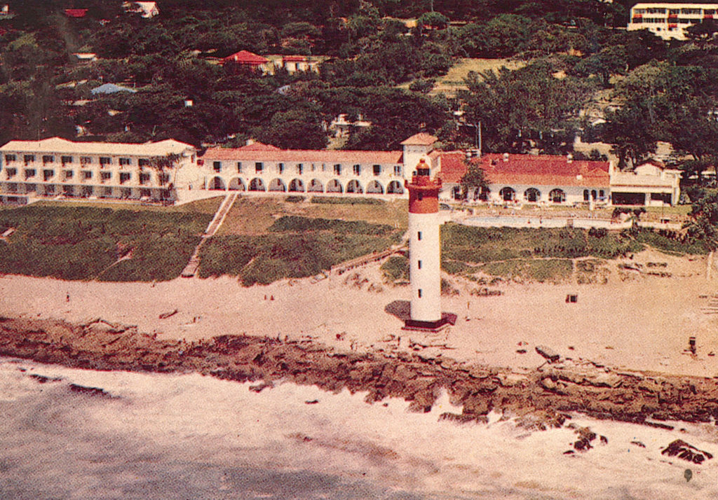 A romantic lighthouse on a beach for Valentine's Day.