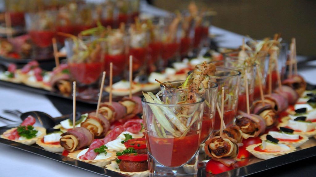 A tray of the best Spanish tapas and drinks is laid out on a table.