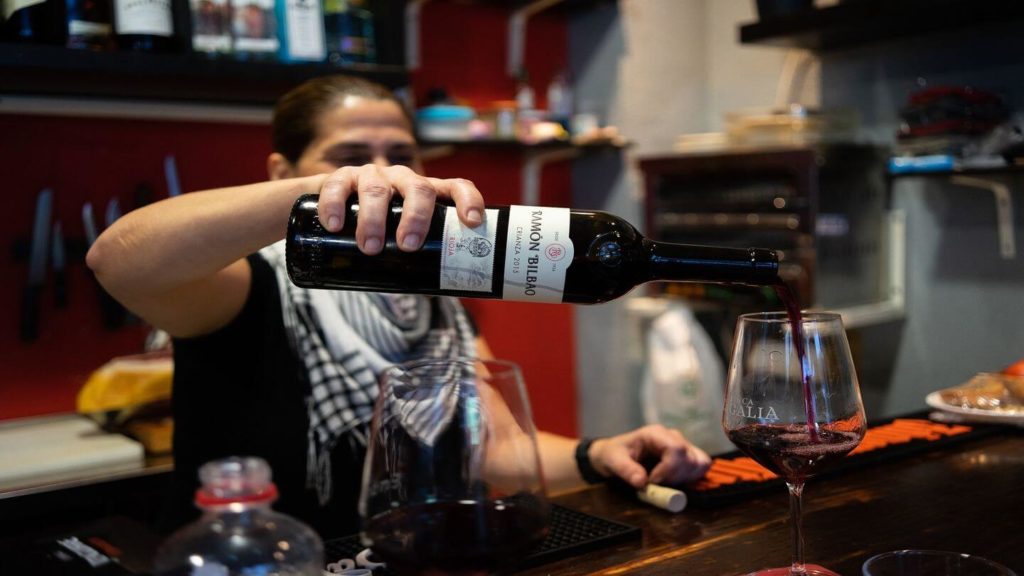 pouring wine tapas bar Spain