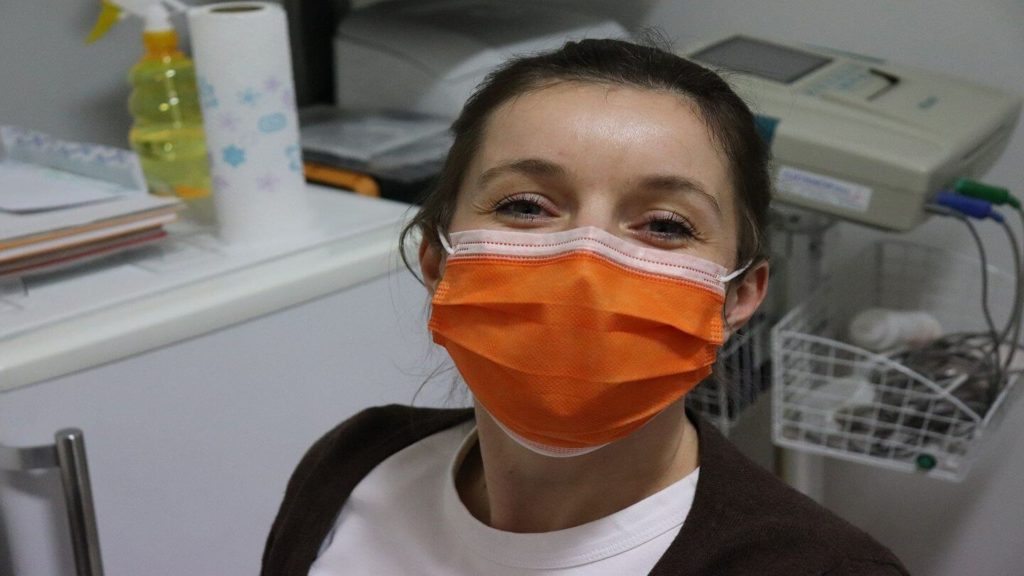 woman wearing surgical mask