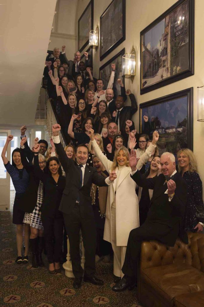A group of people posing for an international day of families picture.