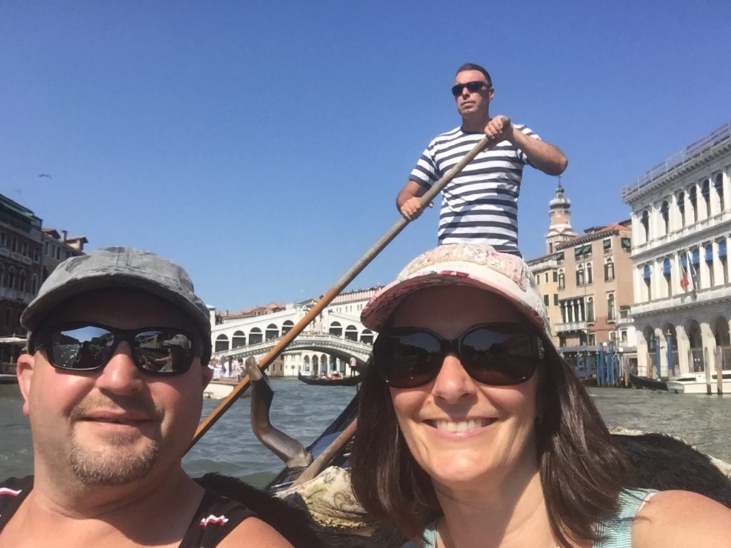 A cancer survivor and a woman on a gondola in Venice.