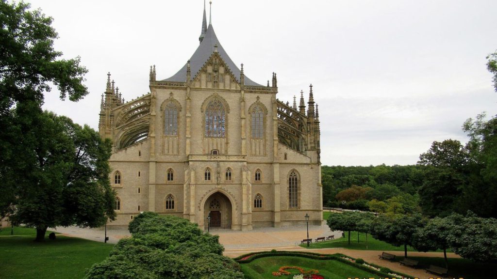 Exterior of large church in a park setting 