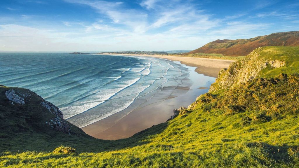 green hills blue ocean coast of England
