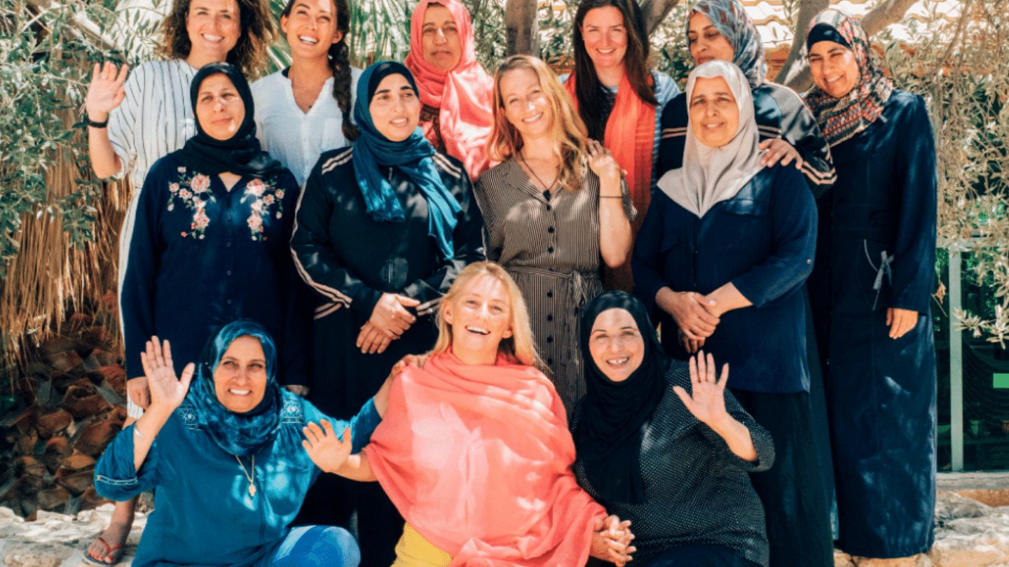 A group of women from Iraq Al Amir smiling