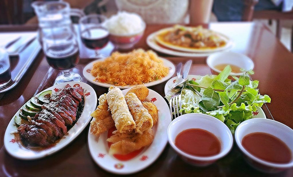 Asian meal grilled meat spring rolls salad 
