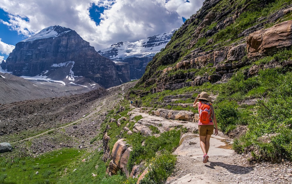 Women hiking in Canada with brown sun hat.