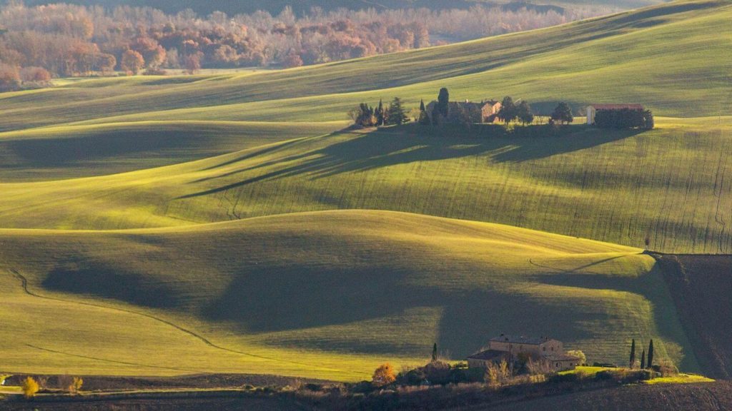rolling green fields travelling to Italy