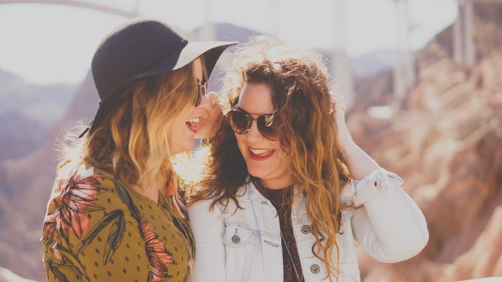 two women laughing together