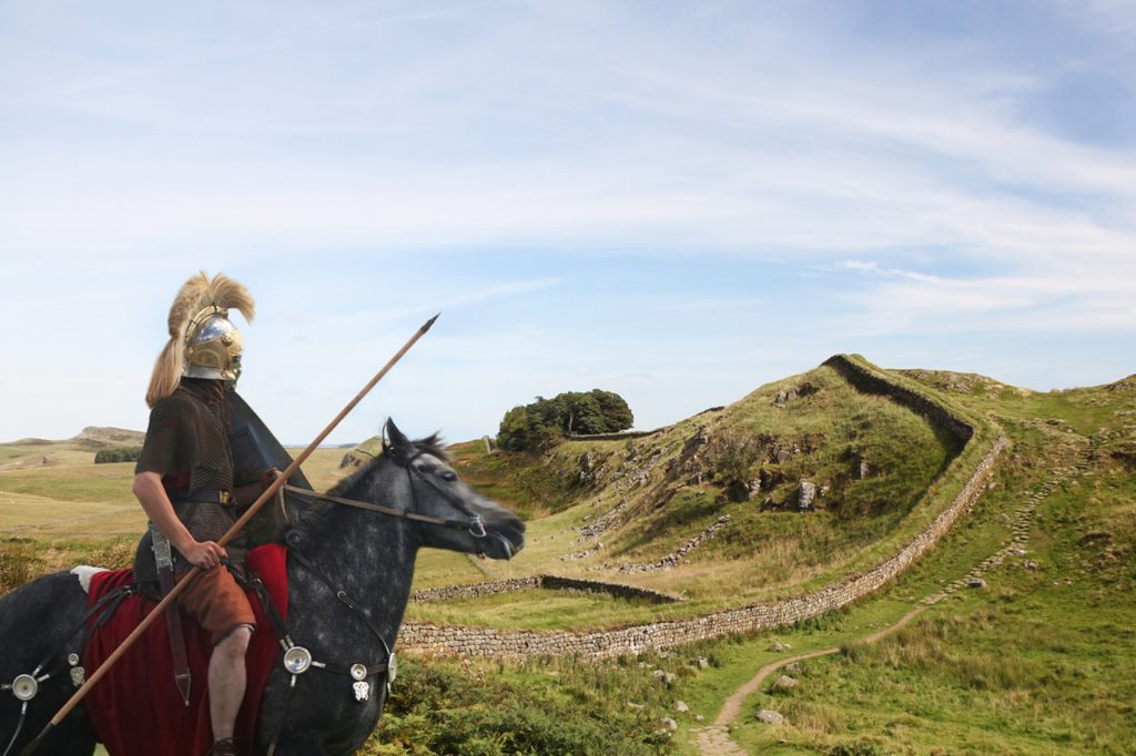 Roman soldier riding a horse along Hadrian's Wall England