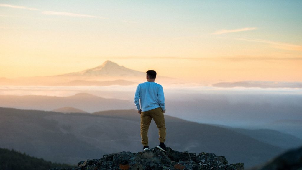 man standing on a mountain