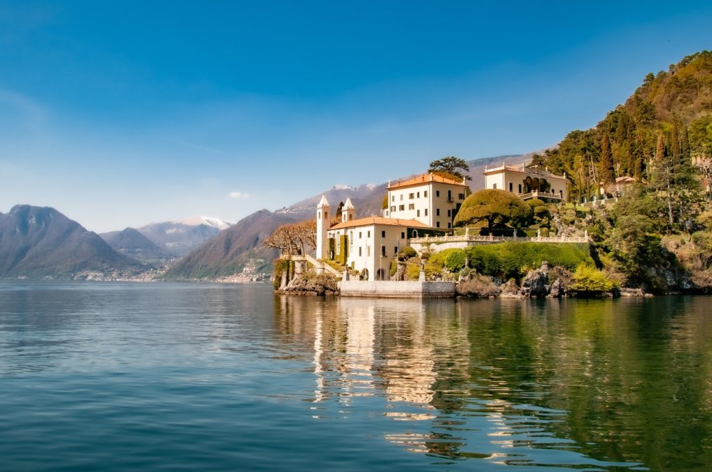 Villa on the shore of Lake Como with a mountain backdrop, featured in House of Gucci.