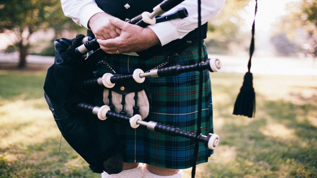 person wearing a Scottish kilt and bagpipes