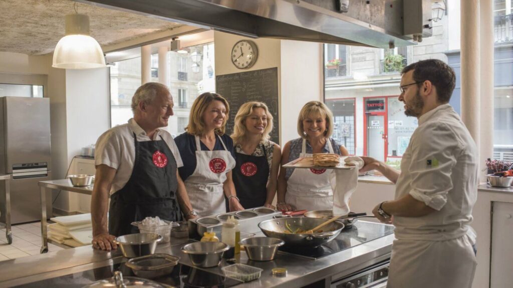 four Trafalgar guests in a cooking lesson