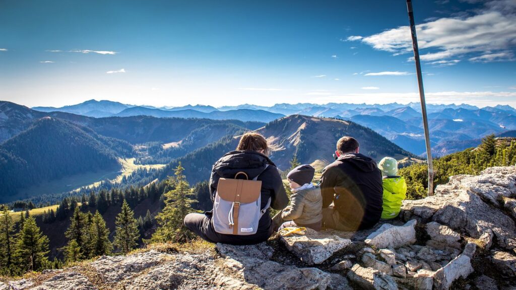 family hiking in mountains