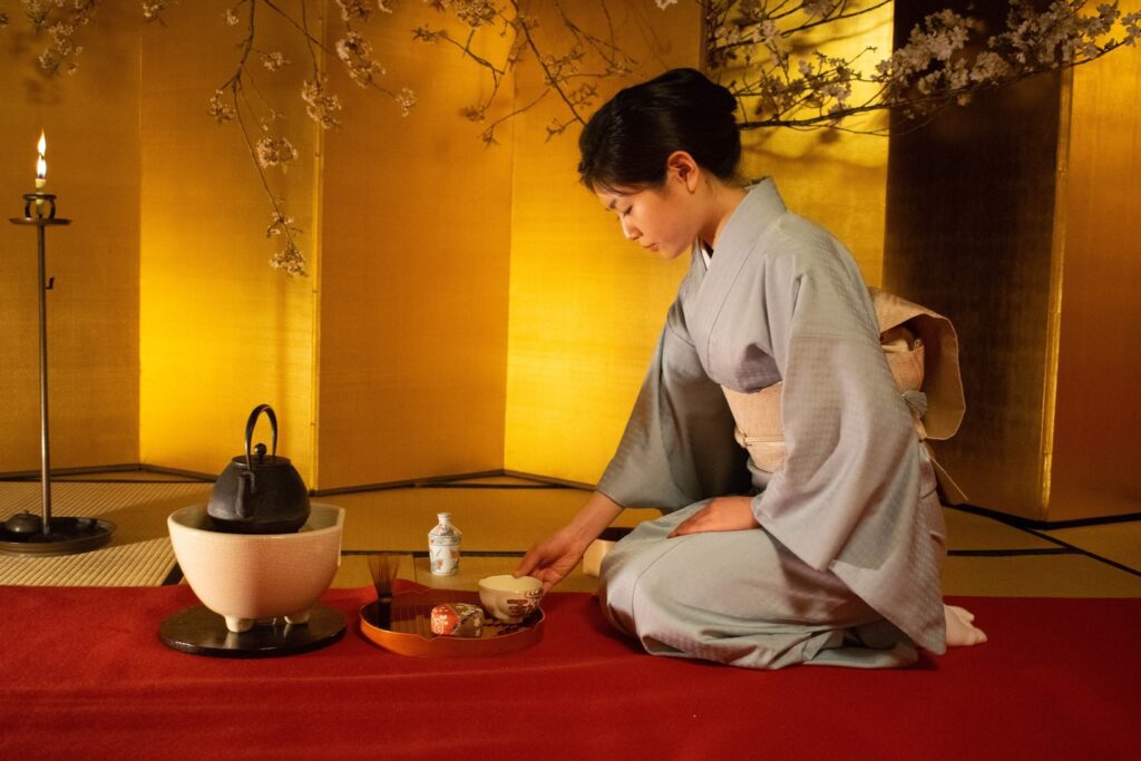 Japanese woman performing a tea ceremony useful Japanese phrases