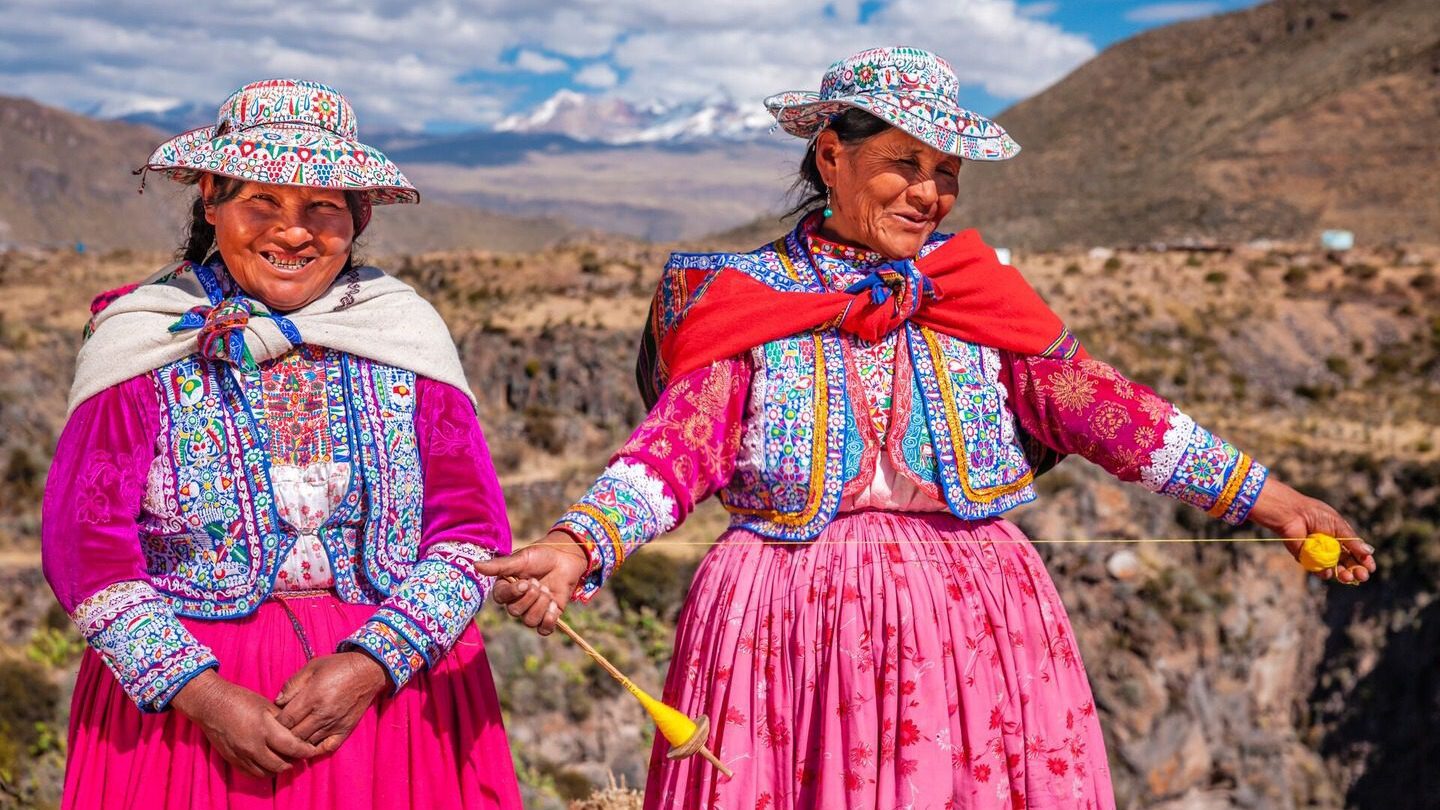 Quechuan women showing weaving techniques in Peru 