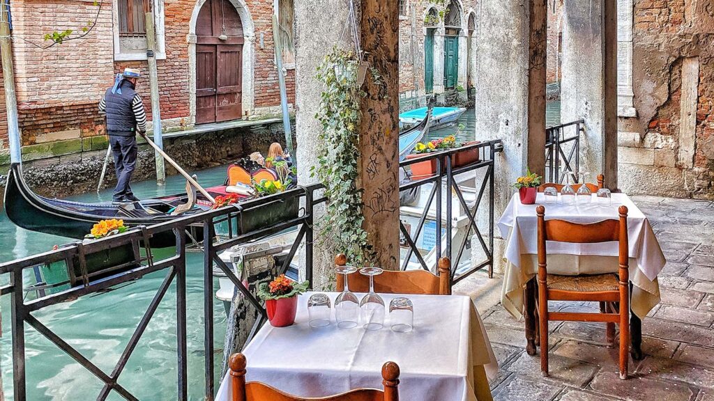 Venice gondola and restaurant tables