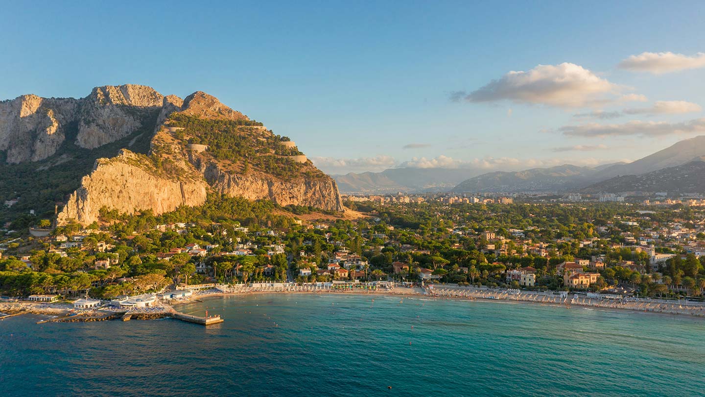 A panoramic view of the popular U-shaped Mondello Beach nearly Palermo, Italy.