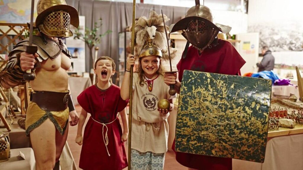 A family dressed in Roman costumes poses for a picture during their holiday.
