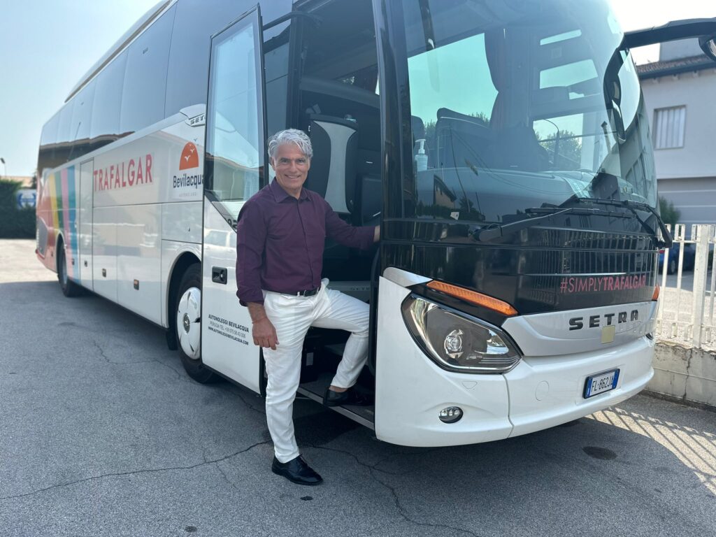Massimo, coach driver for Trafalgar posing in front of his coach