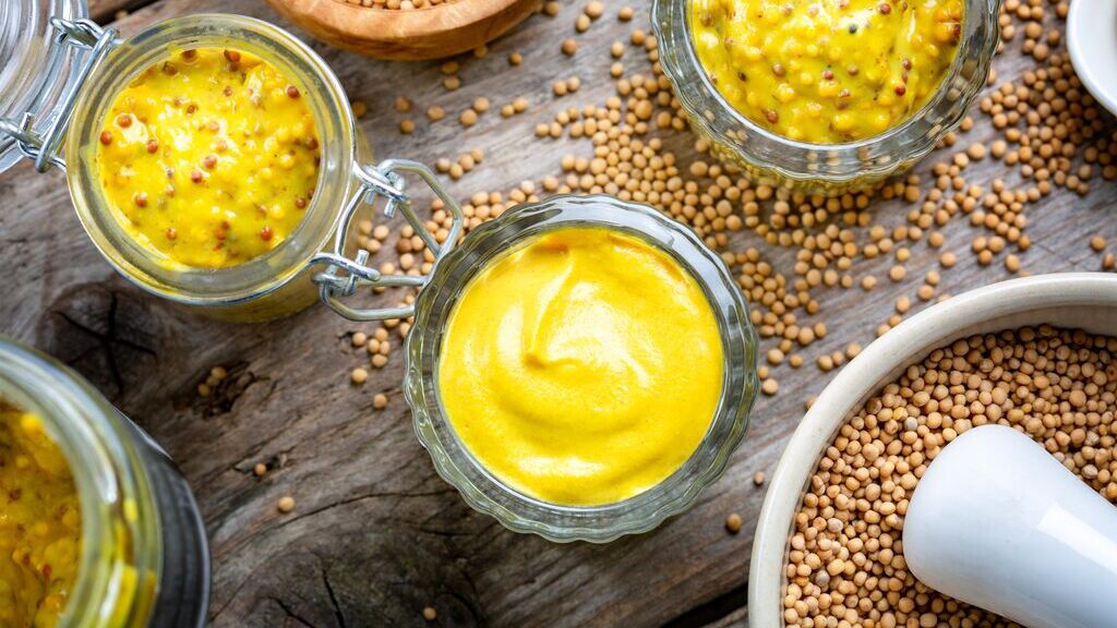 dijon mustards on wooden barrel